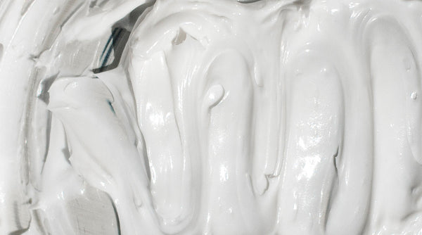 White anti-ageing cream texture macro shot